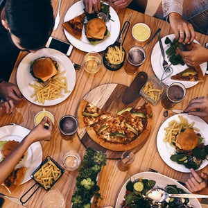 Friends eating around a table
