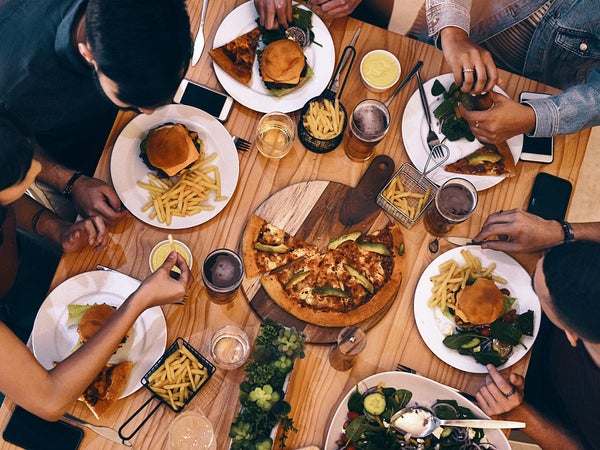 Friends eating around a table