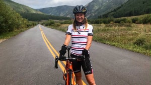 Expert Advice on How to Travel with Your Dog The author posing by her bicycle