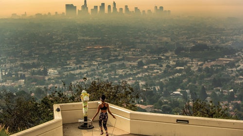 Los Angeles resident Carmen Green jumps rope at a closed Griffith Observatory where she found a quiet nook to exercise in spite of dense smoke from Southern California wildfires choking the L.A. Basin on Thursday, Sept. 17, 2020 in Los Angeles, CA.