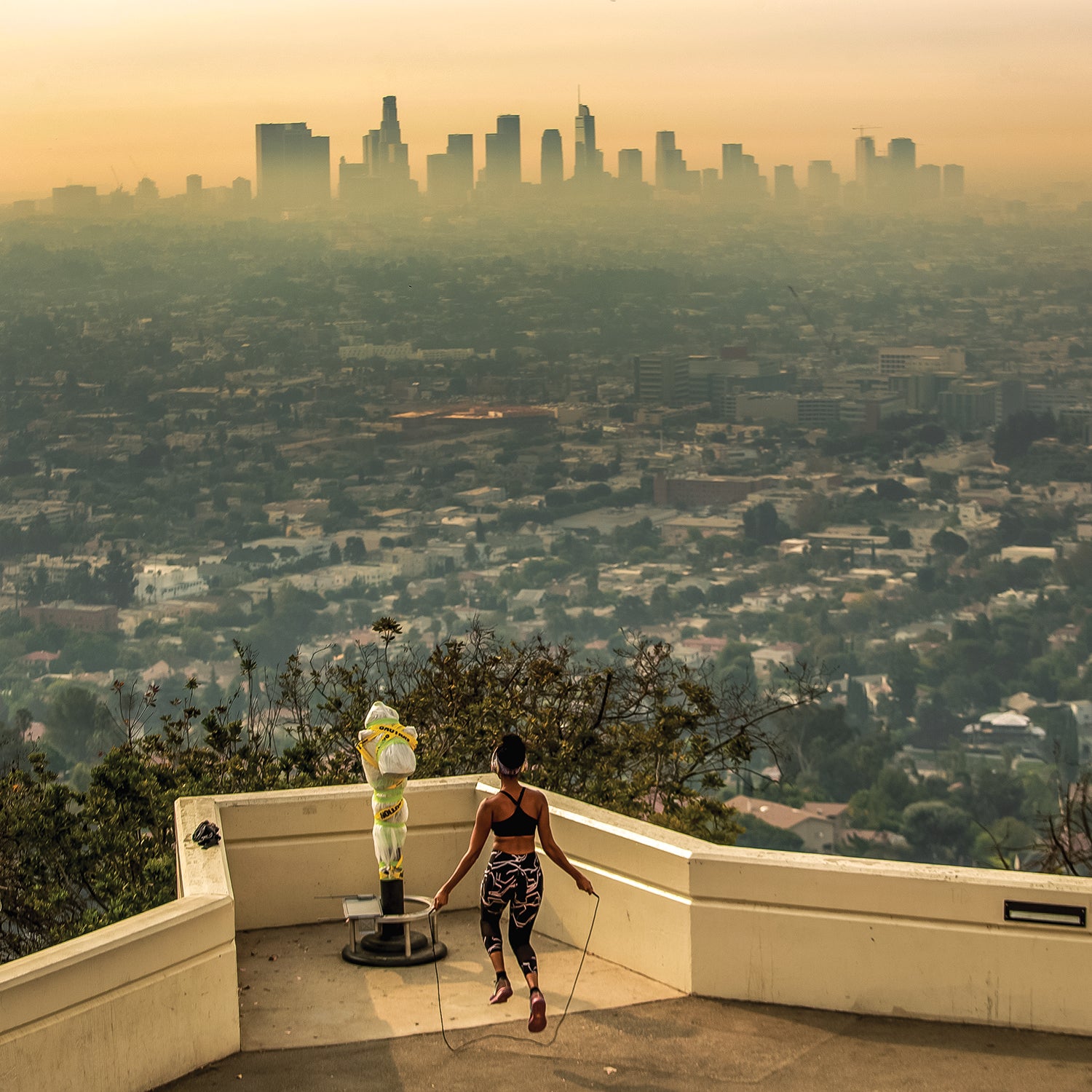 Los Angeles resident Carmen Green jumps rope at a closed Griffith Observatory where she found a quiet nook to exercise in spite of dense smoke from Southern California wildfires choking the L.A. Basin on Thursday, Sept. 17, 2020 in Los Angeles, CA.