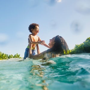 Mother and son playing in the pool