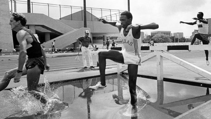 Sang competes in a steeplechase race against others in a black and white photo