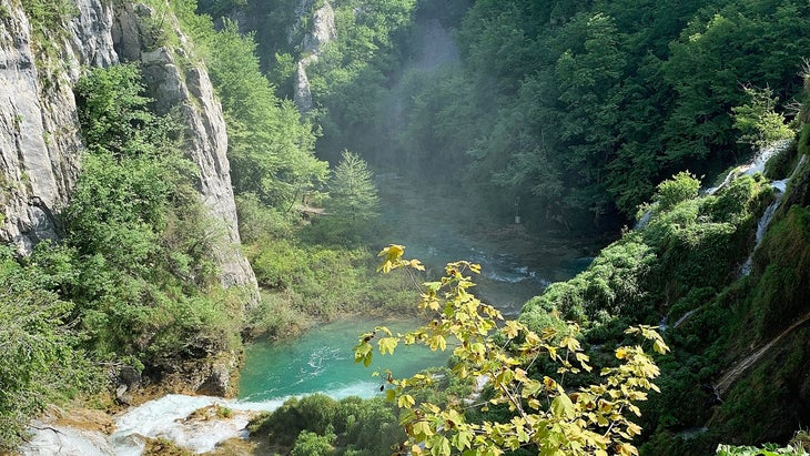 High angle view of idyllic cascading turquoise colored lakes at Plitvice Lakes National Park, Central Croatia at summer time.