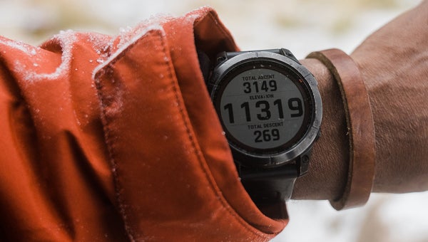 Close-up of hiker wearing a sport watch