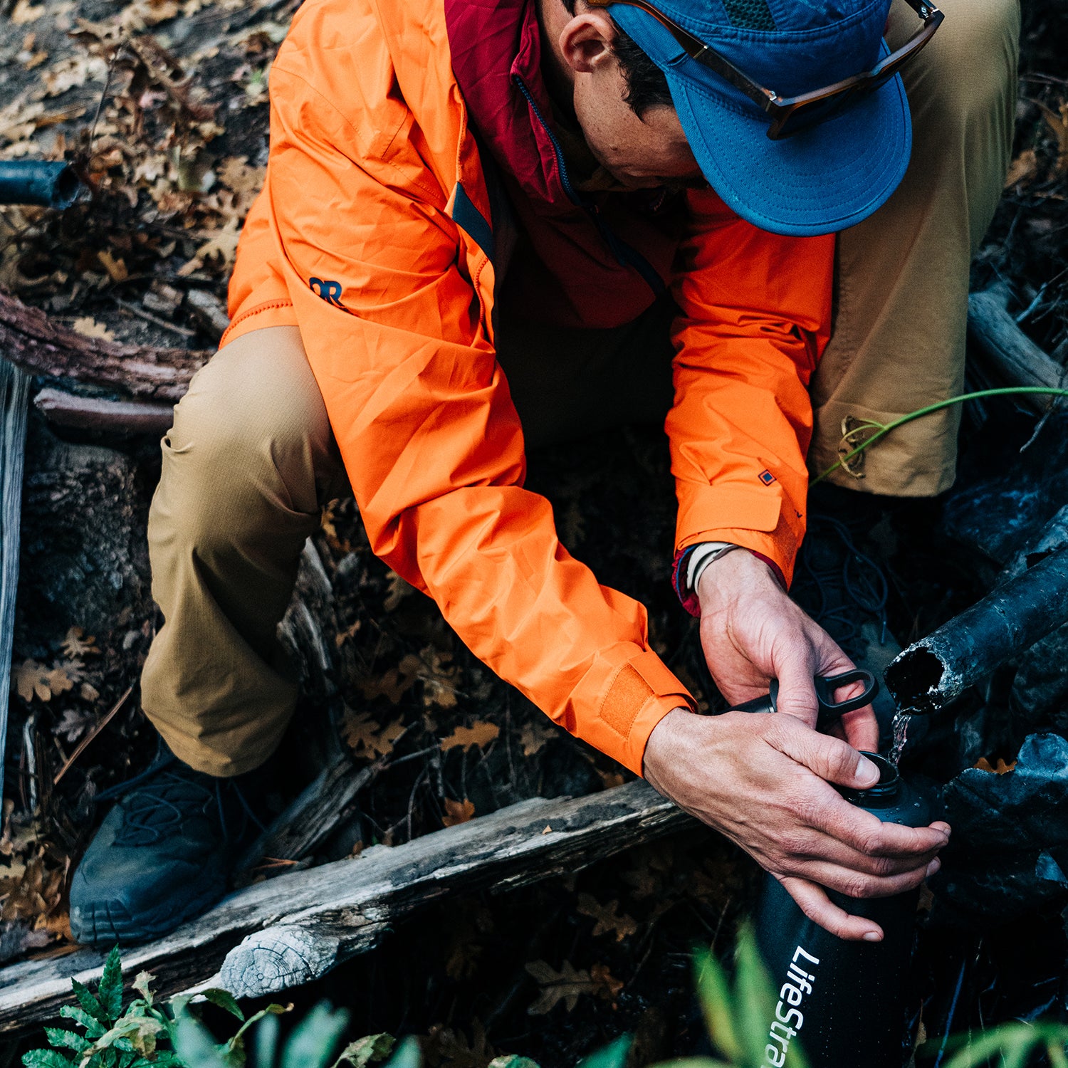 Hiker using a LifeStraw water filter