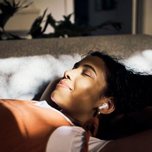 Woman listens to a podcast for sleep