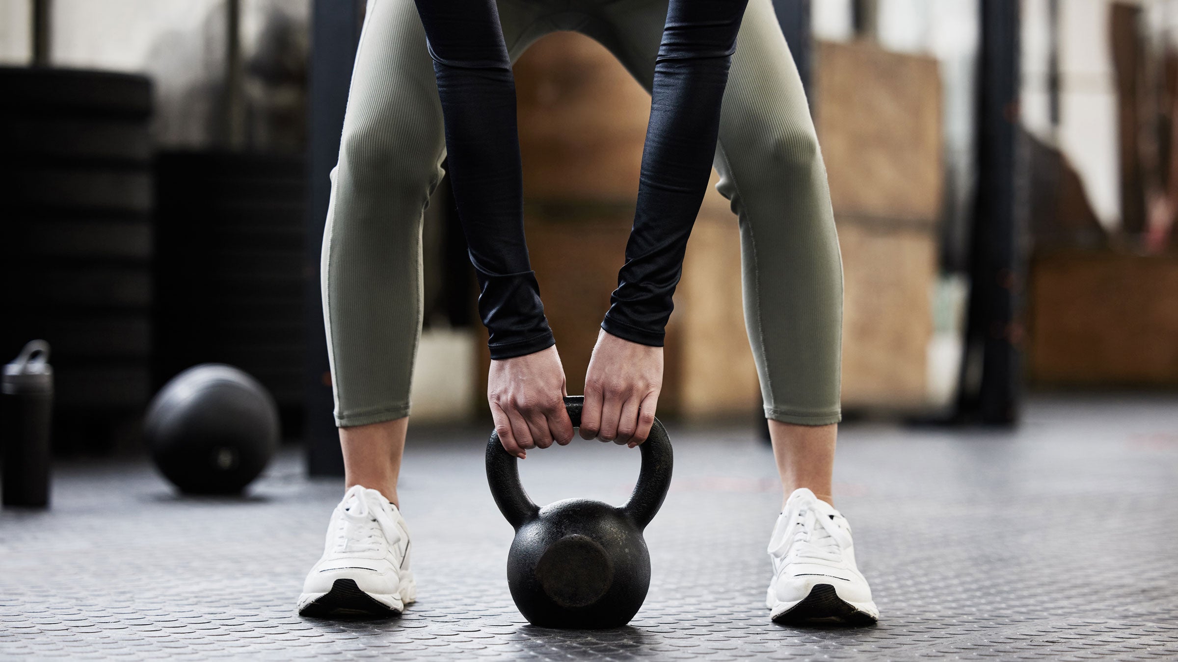 Woman does strength training at the gym