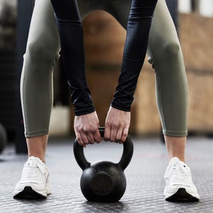 Woman does strength training at the gym