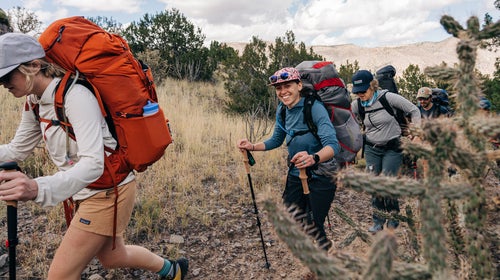 hikers testing backpacking gear on a trail