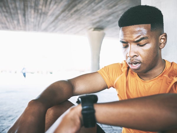 Shot of a young man taking a break after his workout against an urban background
