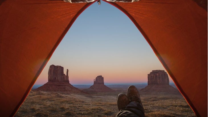 The Mittens formations at Monument Valley, seen from inside an orange tent
