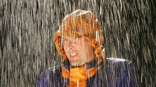 man in pouring rain during a camping fail