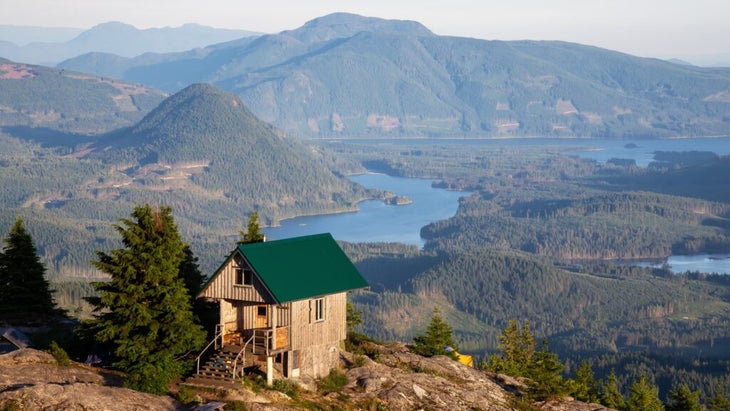 The Tin Hat Hut is set on a bluff overlooking the mountains and lakes.