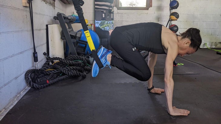 Woman does a hip flexor exercise
