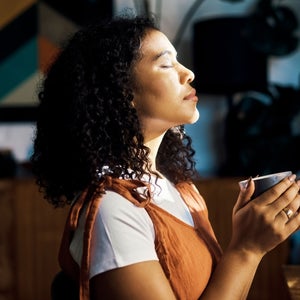 Woman takes a coffee break, benefits of procrastination