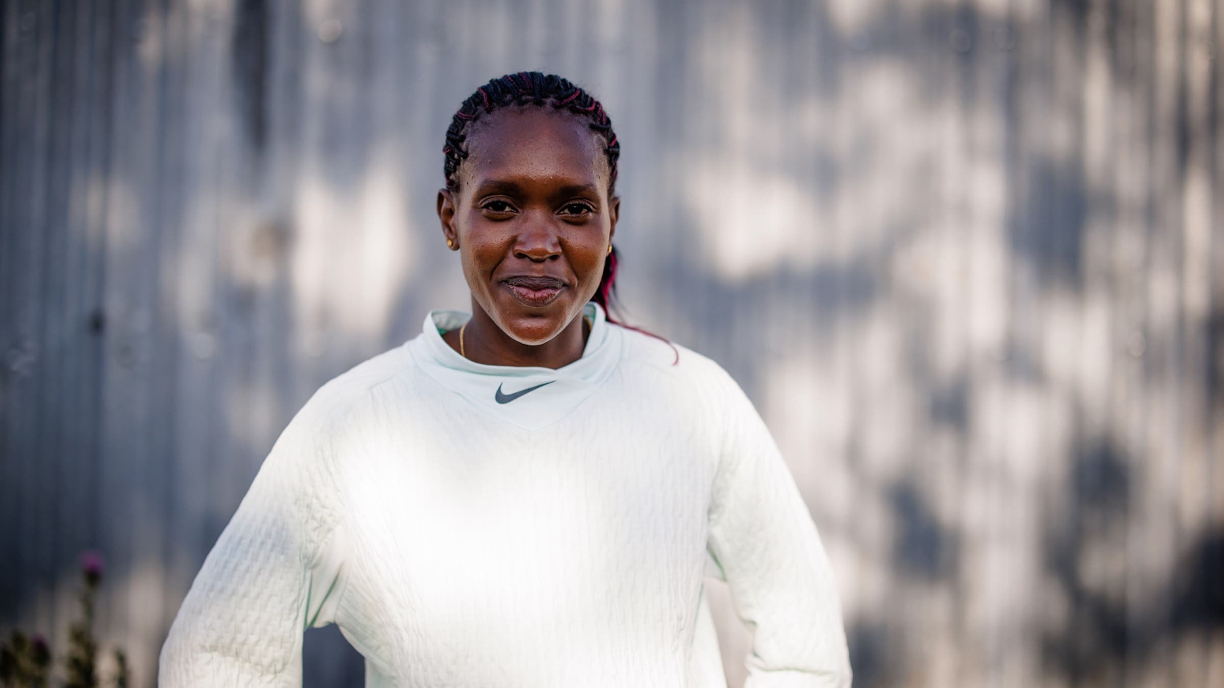 Faith Kipyegon in a white shirt