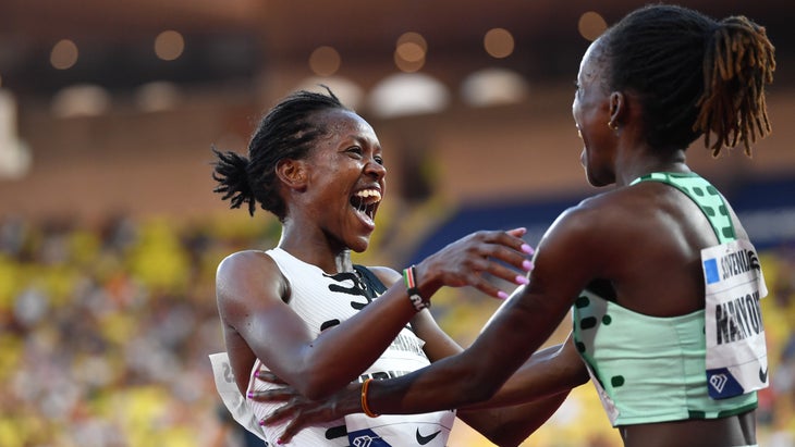 Two track elite women celebrate after a win