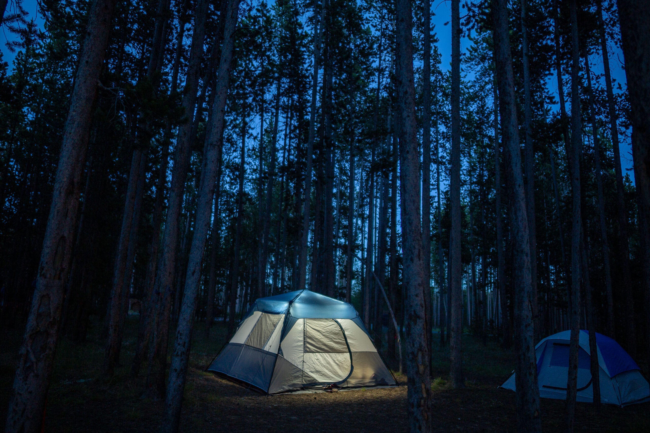 A glowing tent brightening the night in Yellowstone
