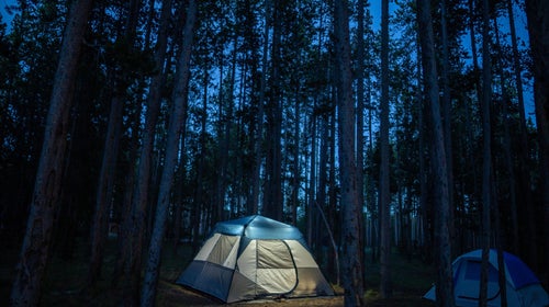 A glowing tent brightening the night in Yellowstone