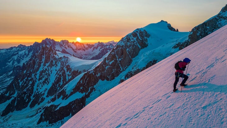 Gerardi climbs Mont Blanc at sunrise with mountains purple and orange sky