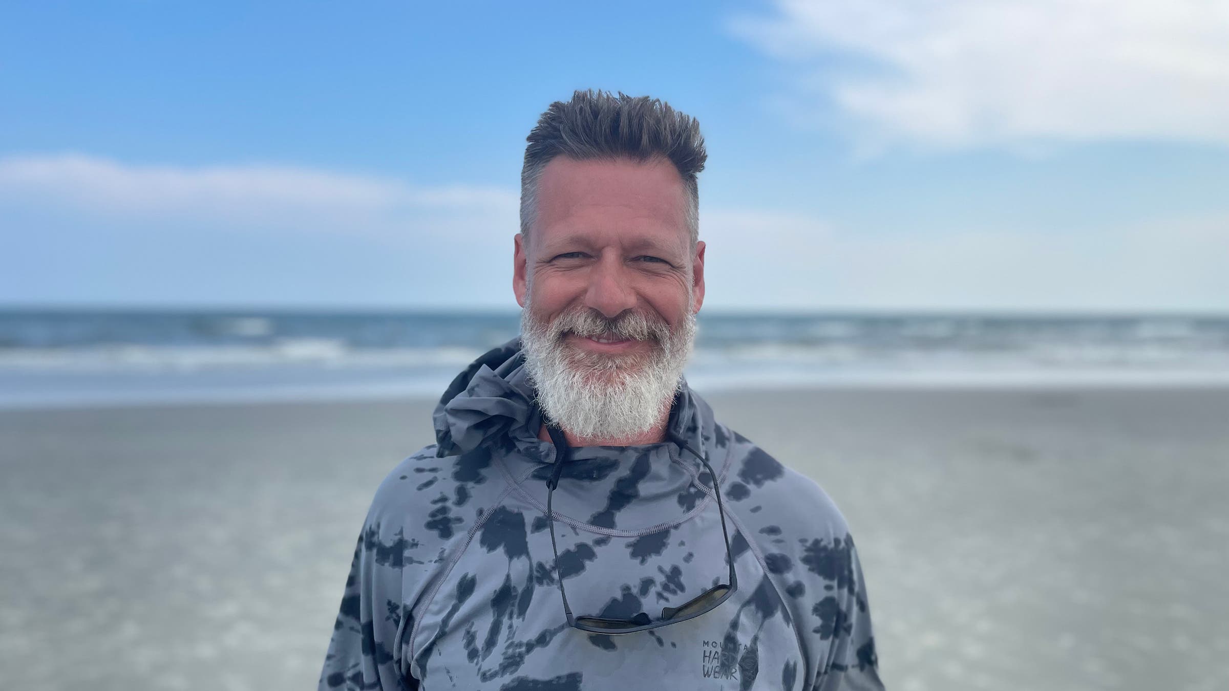 author photo graham averill smiling on beach