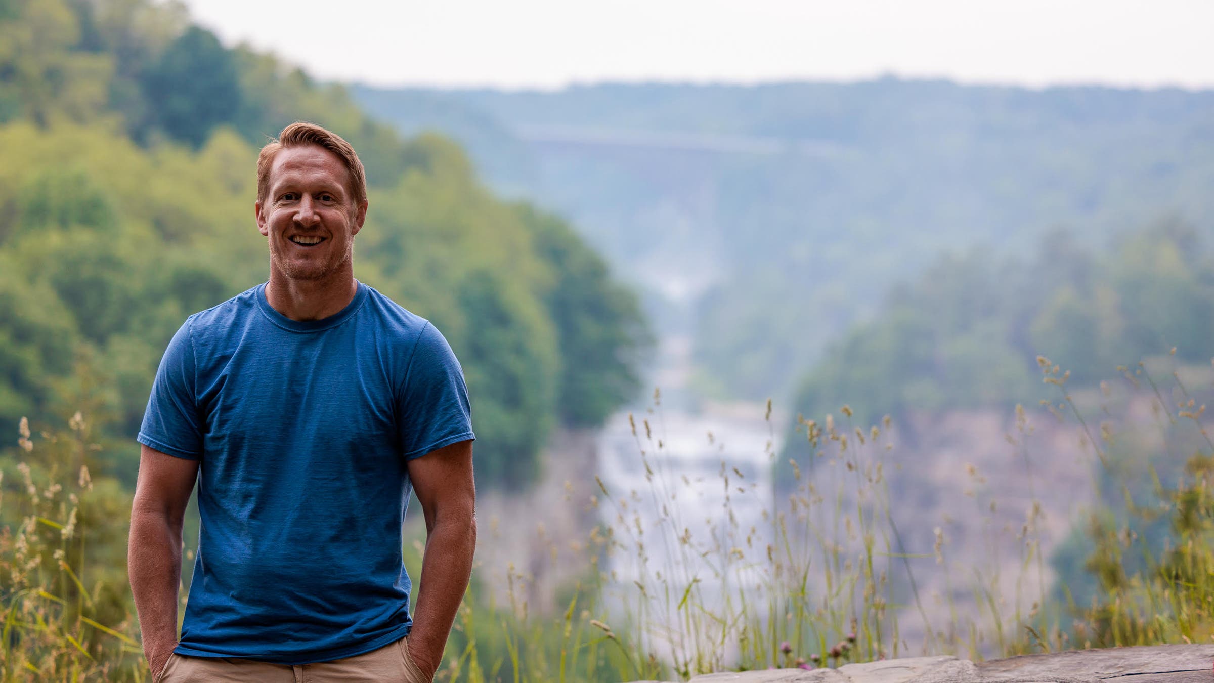 smiling hiker waterfall