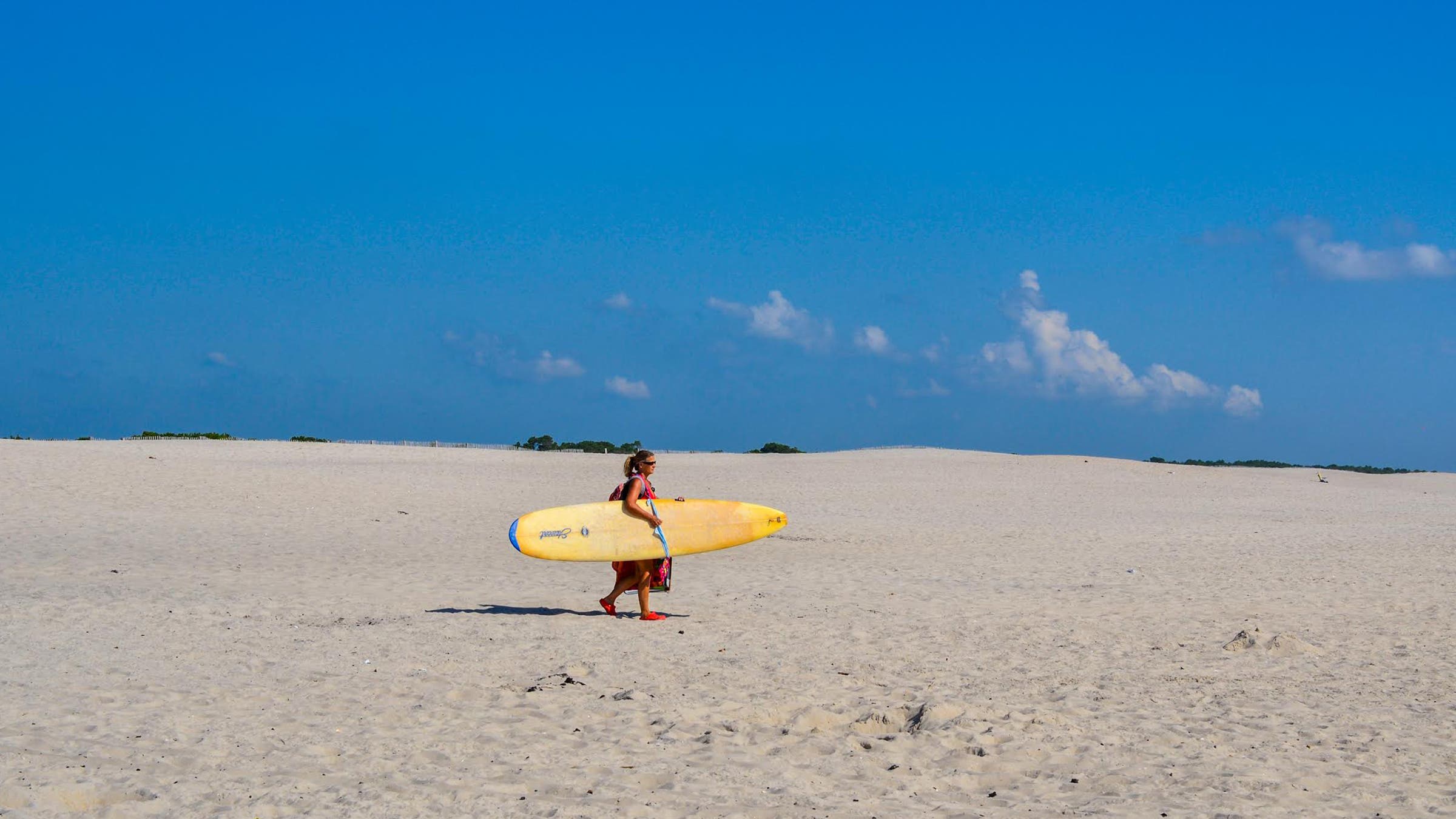 woman with surfboard