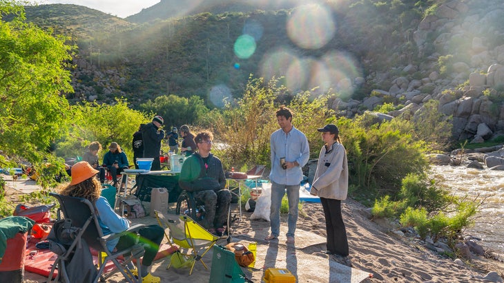 group at campsite enjoying meal