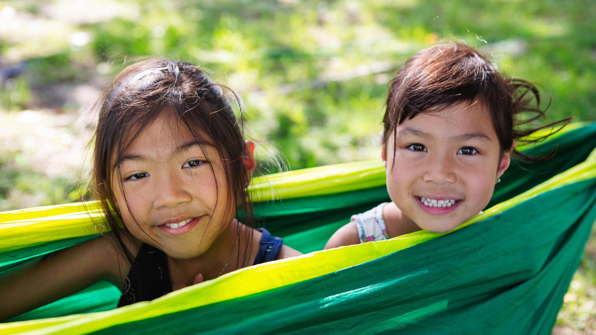 Two girls in a hammock at a campground