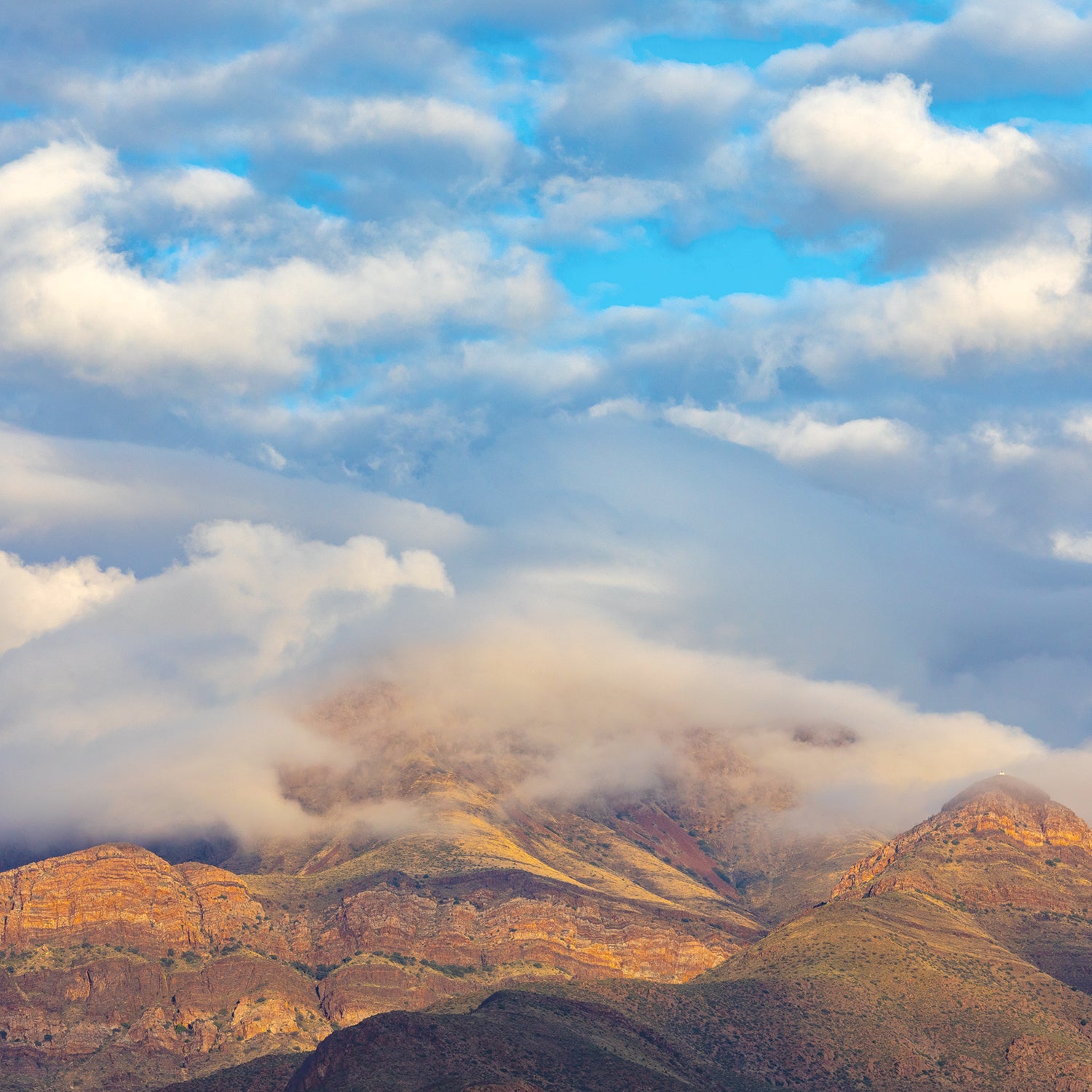 View of the Franklin Mountain Range in El Paso, Texas during a cloudy morning at sunrise.