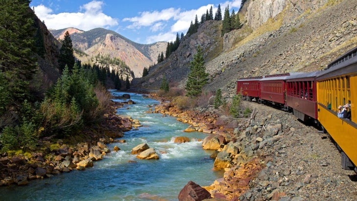 The Durango and Silverton Narrow Gauge Railroad passing alongside the Animas River