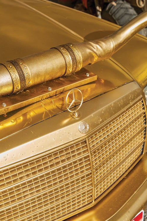 A Mercedes-Benz covered in gold foil, with matching longhorn hood ornament? Welcome to the Gambler.