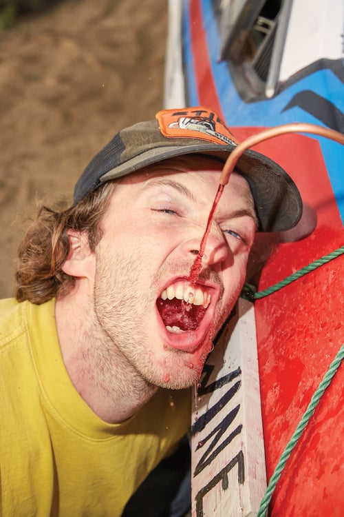 A member of Seattle’s Yummy Yacht Club team sips wine from a trunk dispenser