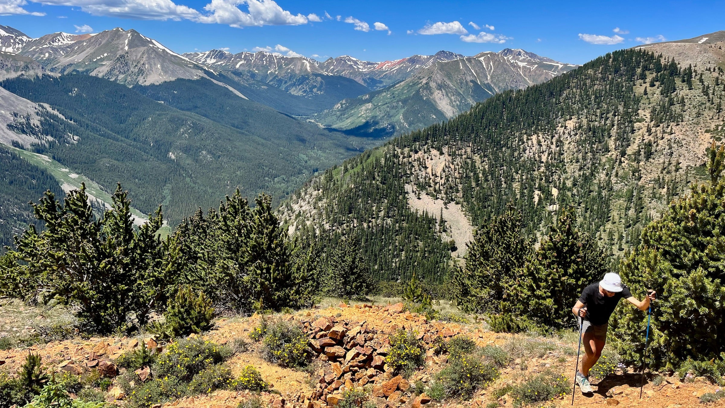 David Hedges hiking up a steep section, to set the Nolans 14 FKT in Colorado