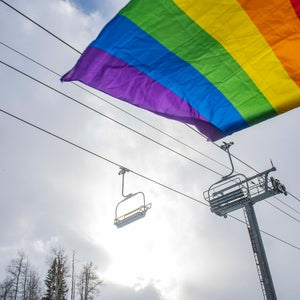A pride flag waves in the wind under a lift in Mountain Village during Telluride Gay Ski Week in Mountain Village.