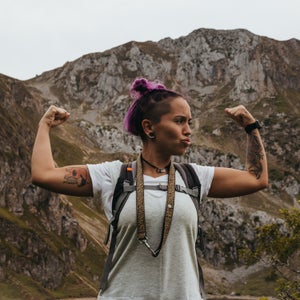 Hiker with a backpack and pink hair getting outside for a hike to help reduce anxiety