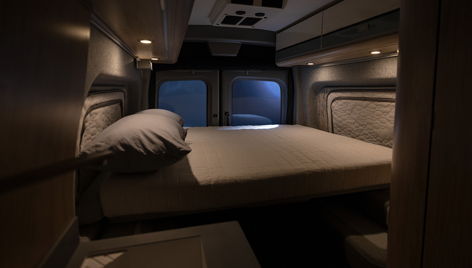 The bed inside of the Winnebago eRV2