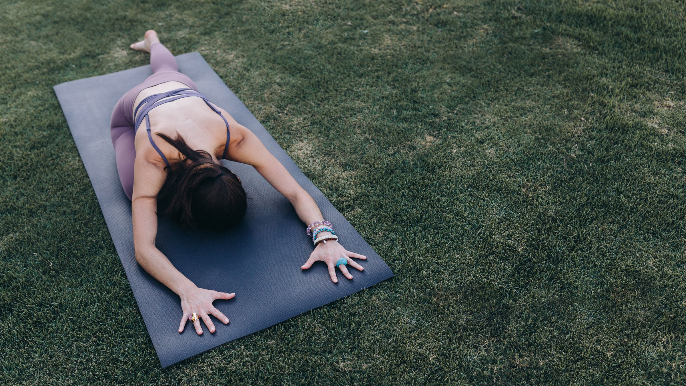 Woman demonstrates Pigeon Pose