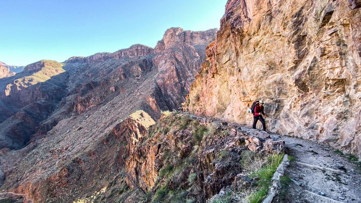 a male hiker with a backpack on the Bright Angel Trail in the Grand Canyon