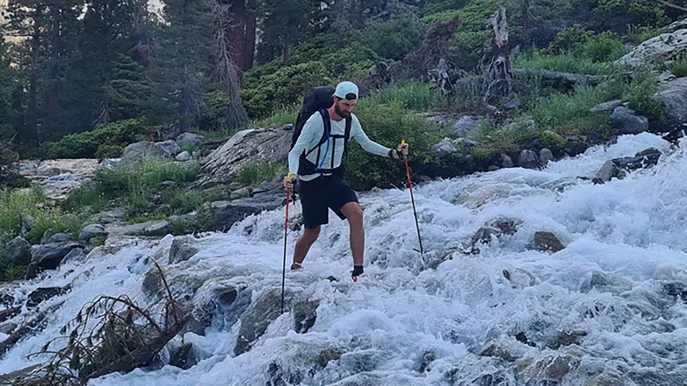 Belgian runner Karl Sabbe navigates a waterfall on foot.