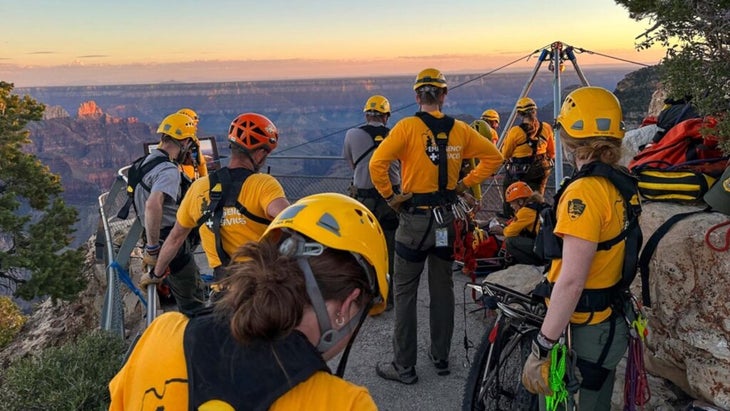 Emergency responders wearing yellow helmets prepare for a rescue at the Grand Canyon.