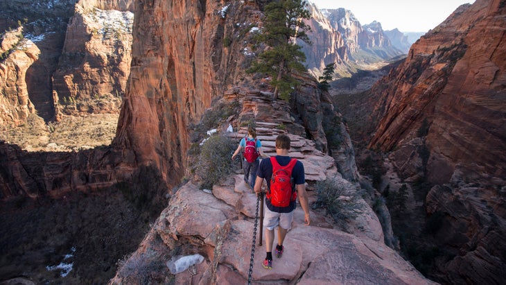 A group hikes Angels Landing in Zion National Park.