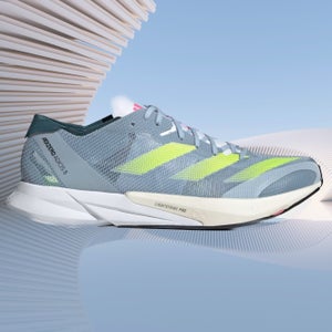 the adidas adios 8 shoe is gray with green stripes