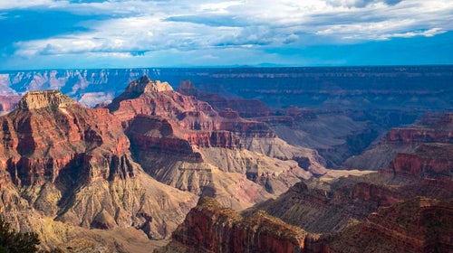 The view from Bright Angel Point shows the Grand Canyon's red ridges and peaks.