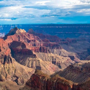 The view from Bright Angel Point shows the Grand Canyon's red ridges and peaks.