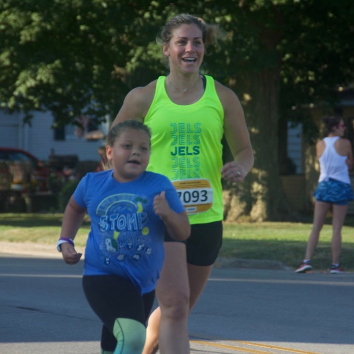 woman and child running