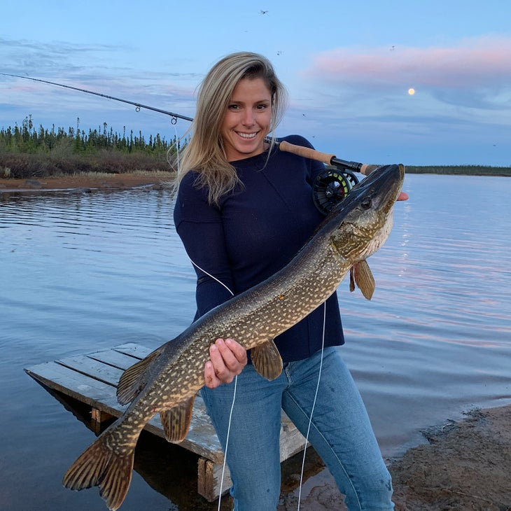 woman with a fish at gangler's inmanitoba