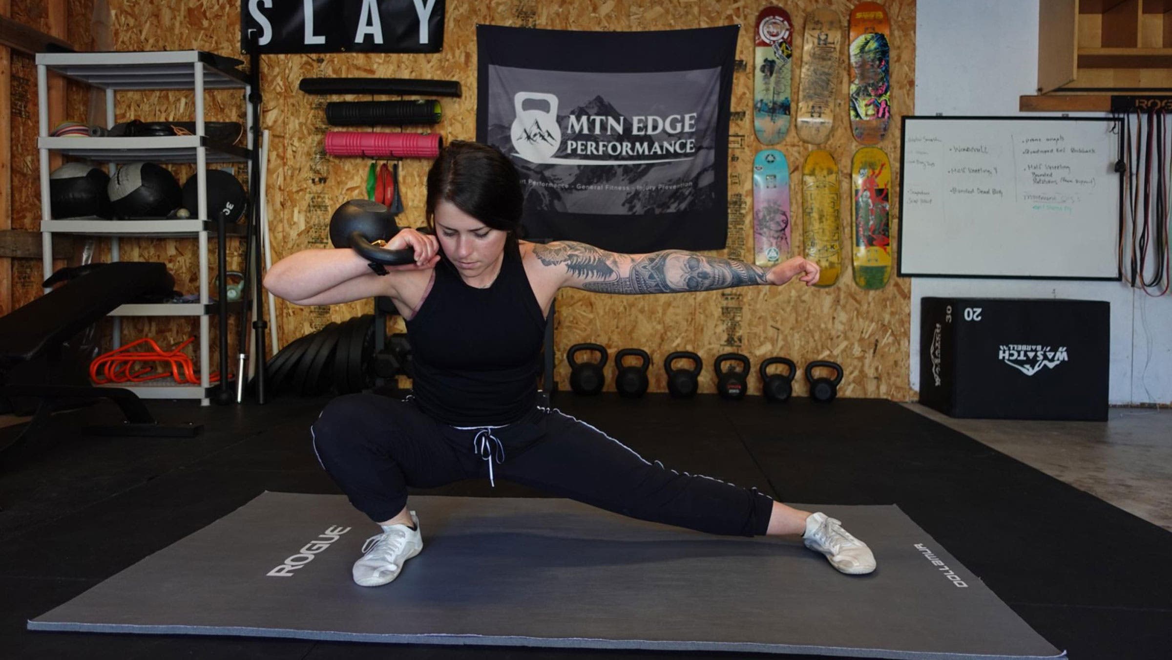 Woman demonstrates a side lunge for a ski workout