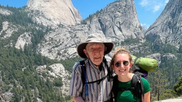 Everett Kalin and his granddaughter Sidney smile at the top of Half Dome.
